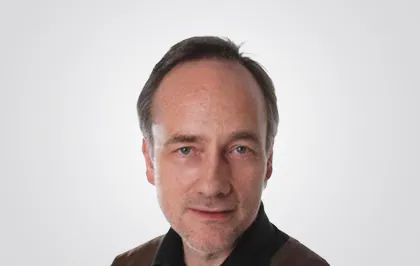 Dr.<br>Thomas Flietner